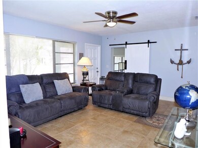 Spacious living area with ceramic tiles & stylish