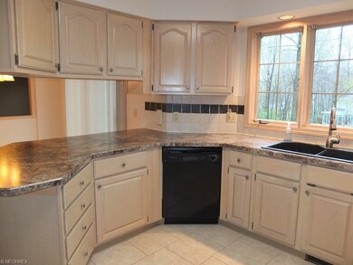 Kitchen with tile backsplash.