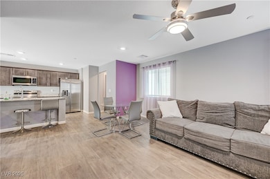 Living room with light wood-style floors, ceiling
