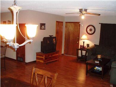 FRONT DOOR ENTRANCE INTO OPEN LIVING AREA.