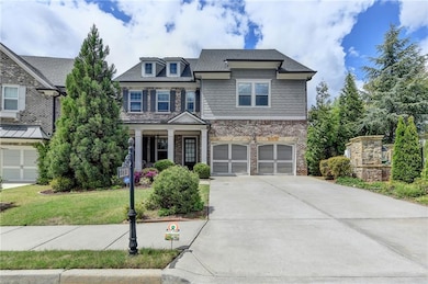 Craftsman house with driveway, an attached garage,