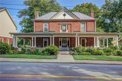 The Dr. J.L. Henderson house has tall windows set 
