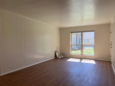 This is a bright and airy living room, featuring a
