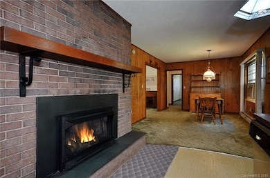 Warm and Inviting Fireplace in the Kitchen and Dining Rooms