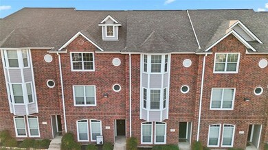 Classic red-brick façade showcasing the townhome units included in this investment package.