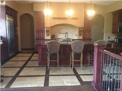 granite countertops, travertine inlay with hands c