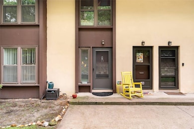 Entrance to property featuring stucco siding