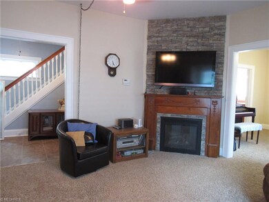 Living room with gas log fireplace with beautiful 