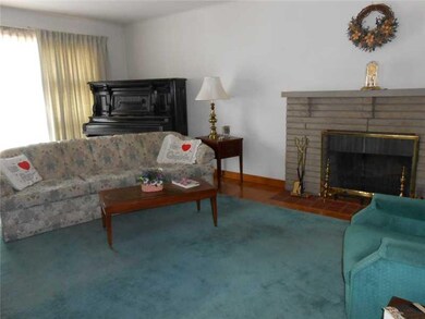 Living Room. Natural sunlight shines through the l