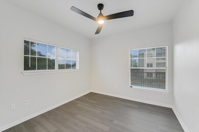 Empty room featuring wood finished floors, ceilin