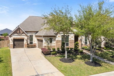 This charming home boasts a striking brick and sto