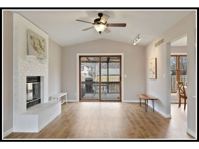 Wood-burning brick fireplace and walk-out to backy