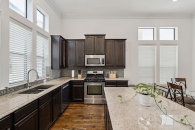 This open kitchen is flooded with natural light an