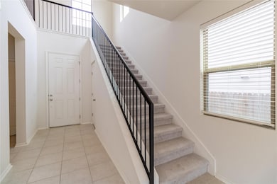 Stairs featuring tile patterned floors and basebo