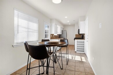 Dining space featuring light ceramic floors overlo
