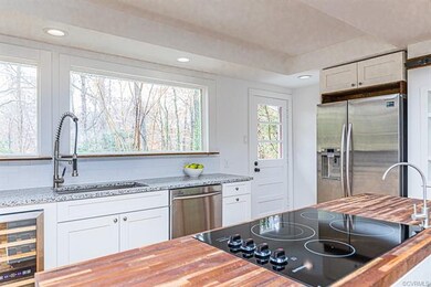 KITCHEN W/ 2 LARGE PICTURE WINDOWS, SS APPLIANCES,