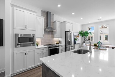 Gorgeous quartz counter tops and stainless appliances.