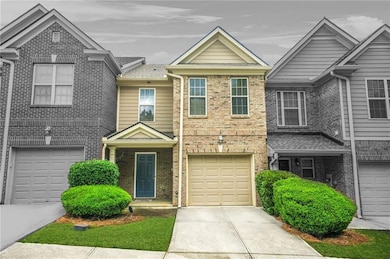 View of front facade with concrete driveway, brick