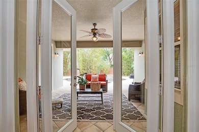 View from living room to lanai and pool area