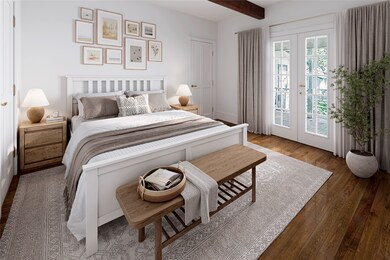One of 2 bedrooms on the 1st floor with French doo