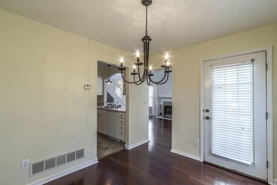 Dining overlooks patio and trees