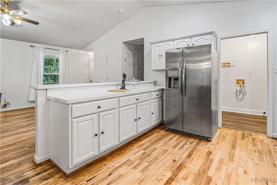 Kitchen featuring stainless steel fridge with ice