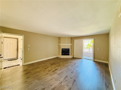 Unfurnished living room with wood finished floors,
