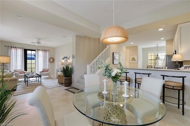 Dining space with light tile patterned flooring, c