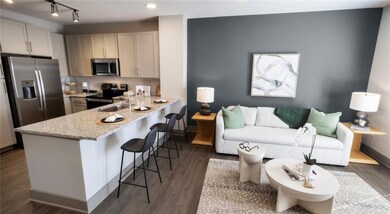 Kitchen featuring rail lighting, dark hardwood / w