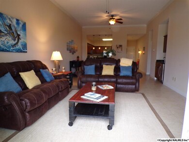 2nd view of living room, notice wet bar on the right with an ice maker