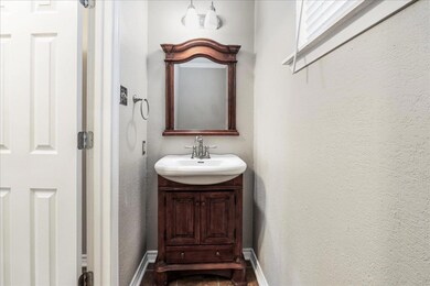 Bathroom with vanity and baseboards