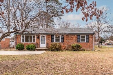 Spacious front yard with trees away from structure