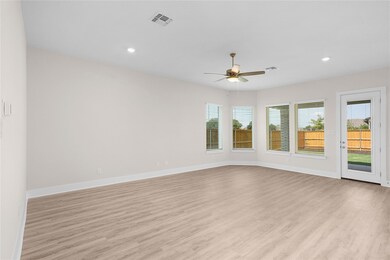 Spare room with ceiling fan, light wood finished 
