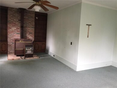 Living room with wood burning heater and gas heate