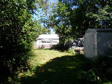 Exterior Back. Right side of the lot has a garage