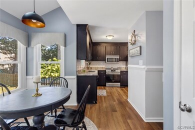 Eat-in kitchen area with pantry and open to cookin