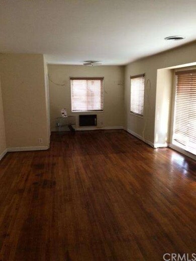 LIVING ROOM. THE HOME HAS CENTRAL HEAT AND AIR. AL