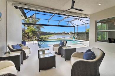 View of swimming pool with a patio area, glass enc