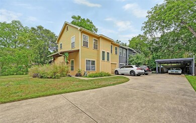 View of property exterior with concrete driveway,