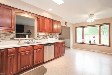 Eat-in kitchen with a serving window to the family