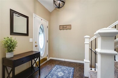 Bright entry walks into vaulted ceilings and open 