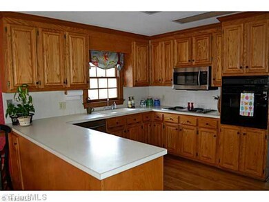 Kitchen. The Kitchen space has hardwoods, lots of light and overlooks the back yard and deck