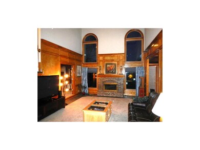 This great room has WOW appeal with soaring ceilin