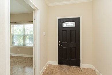 Entry with travertine tile.