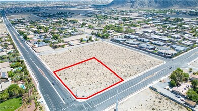 Aerial overview of property's location with property parcel outlined and mountains