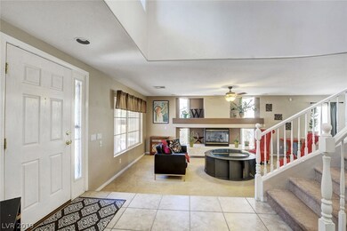 GRAND ENTRY WAY LEADS TO FORMAL LIVING AREA WITH C