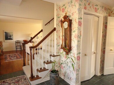 Spacious slate foyer provides a warm welcome to th