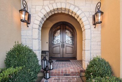 Welcome guest thru custom alder doors with masonry
