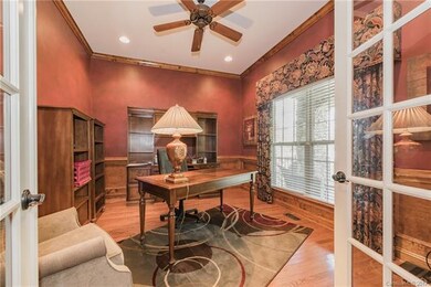 Office/Study has oak crown molding, chair rail and