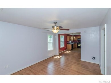 The living room and dining area feature low-mainte